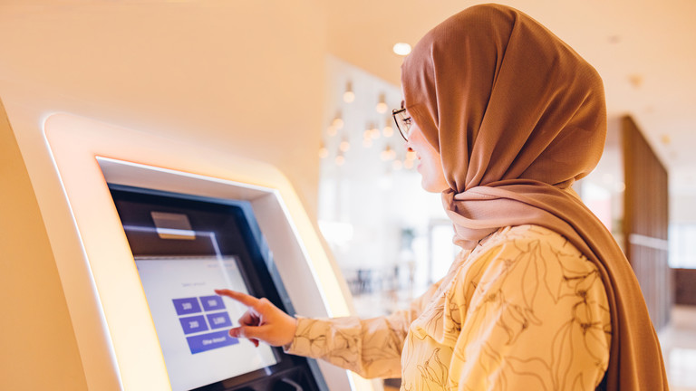 Iran-Girl-in-Use-ATM